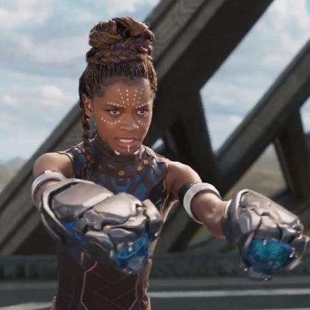 Shuri aiming at Killmonger using her technology.